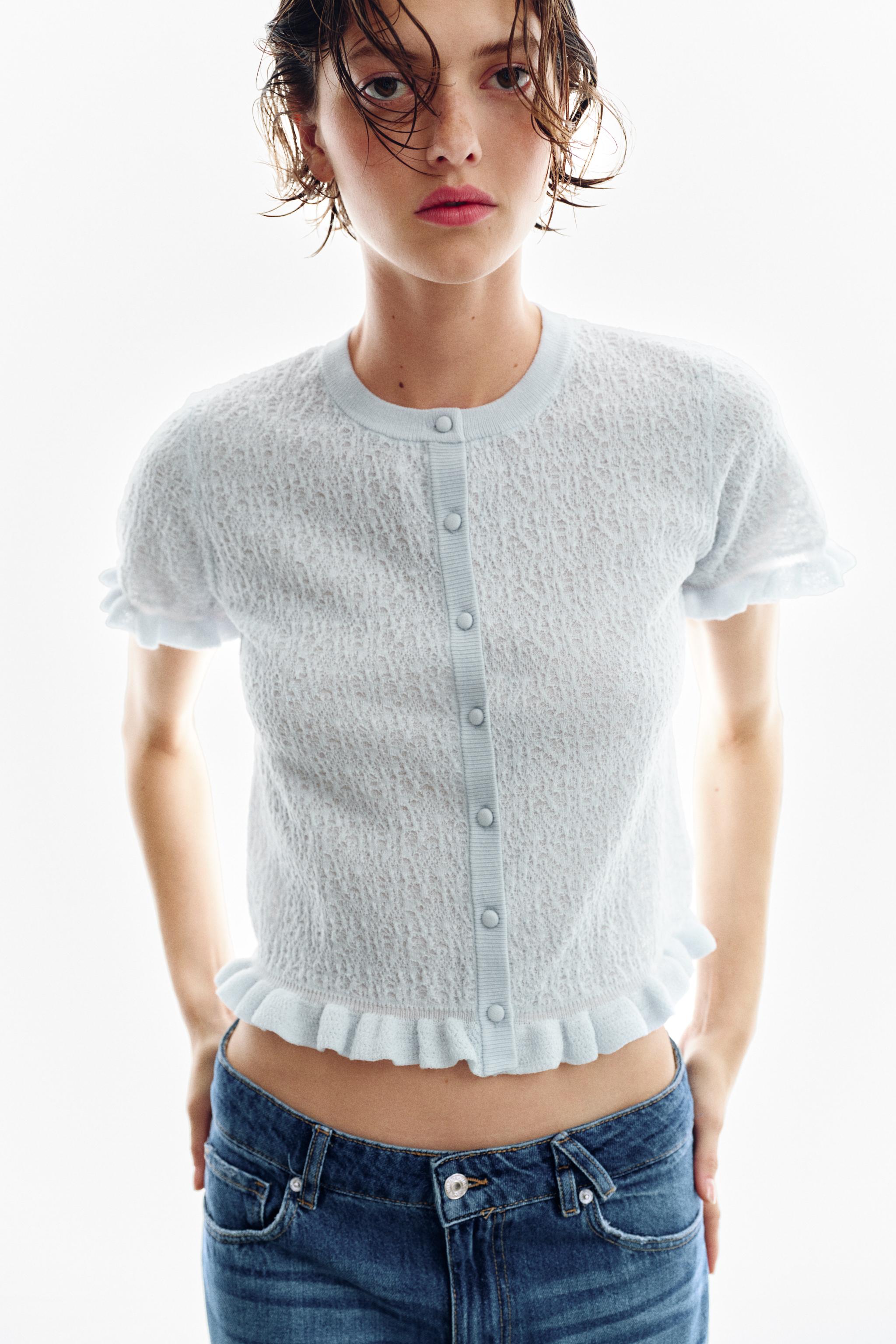 VESTE EN MAILLE STRUCTURÉE À VOLANTS